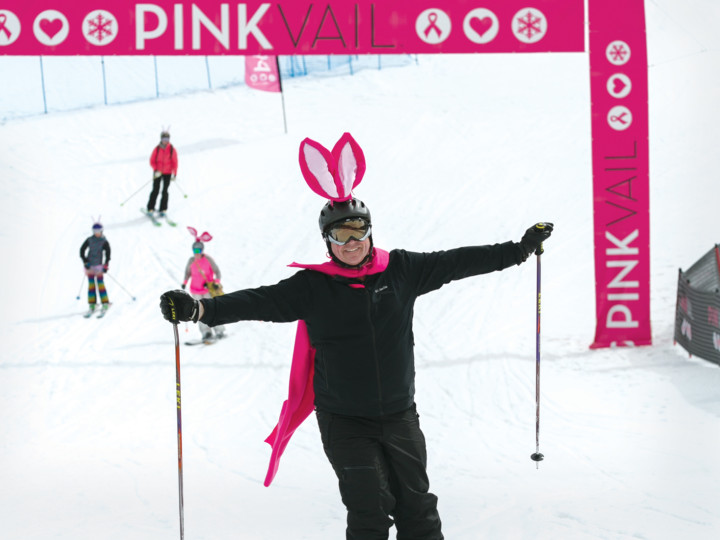 Pink Vail Skiier Under Event Arch